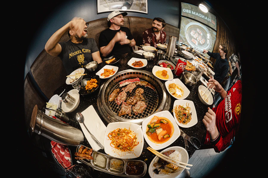 A Korean barbecue table with many side dishes