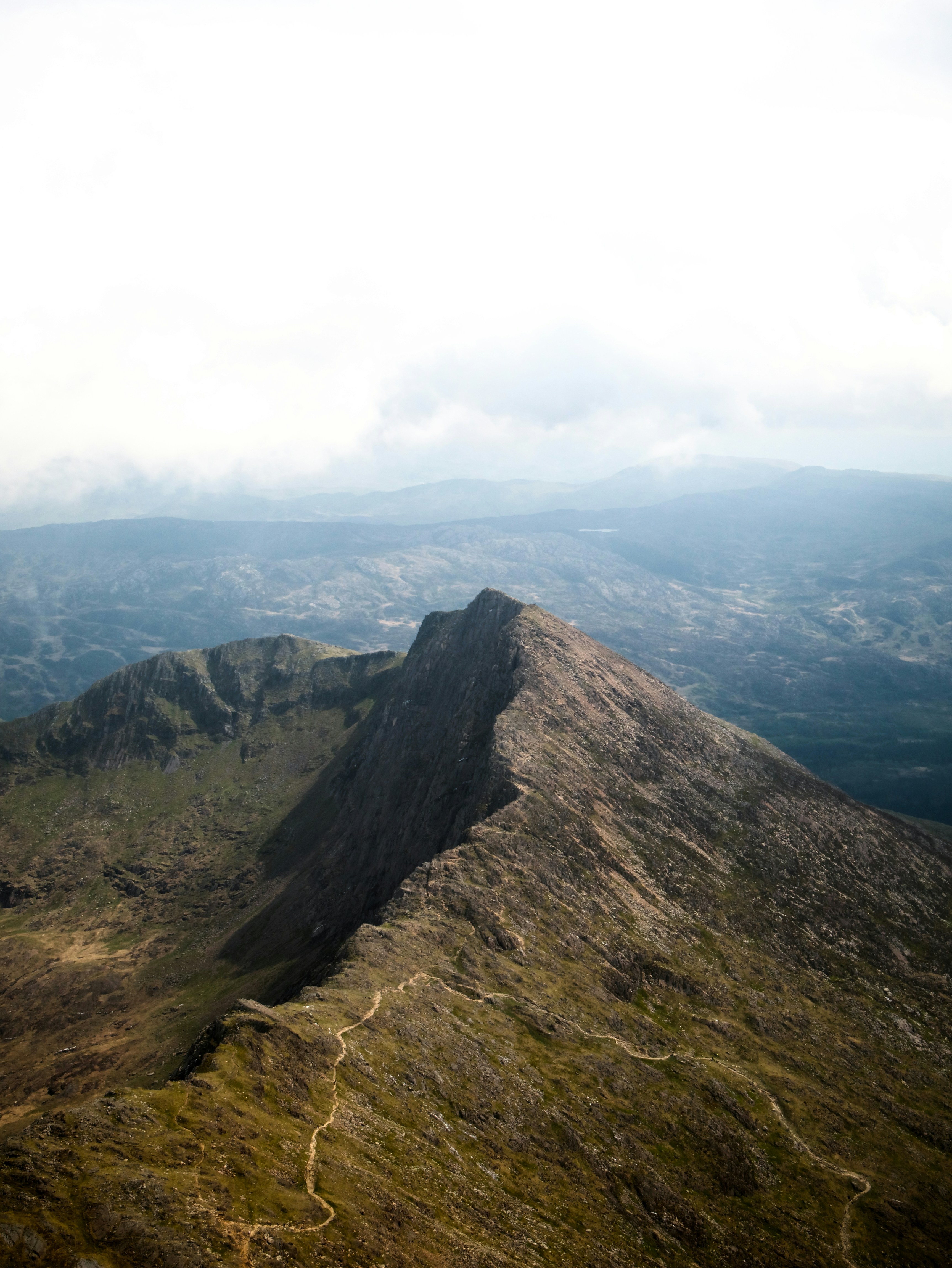 Winding path on a rugged mountain ridge.