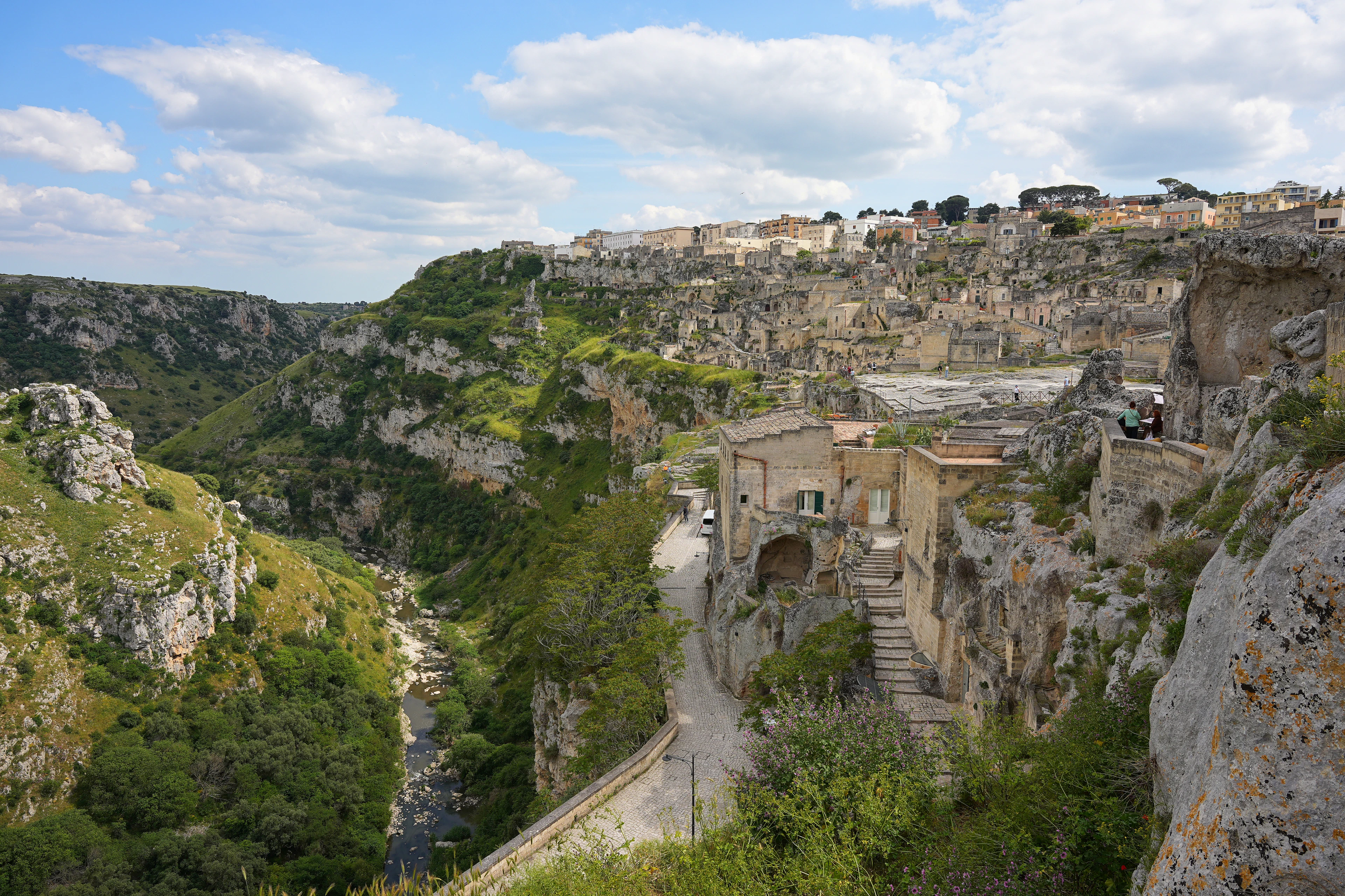 The stone houses of the Sassi di Matera stacked up the ravine, cut into the rock itself