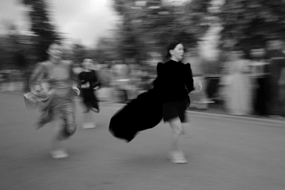 Women in flowing clothes running with motion blur, a sense of energy and momentum