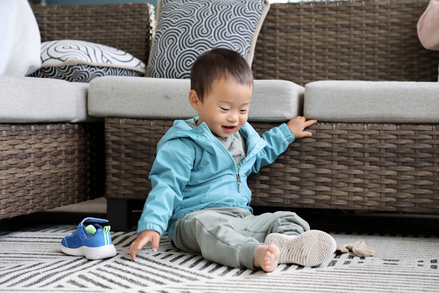 A young child playing happily on a rug at home