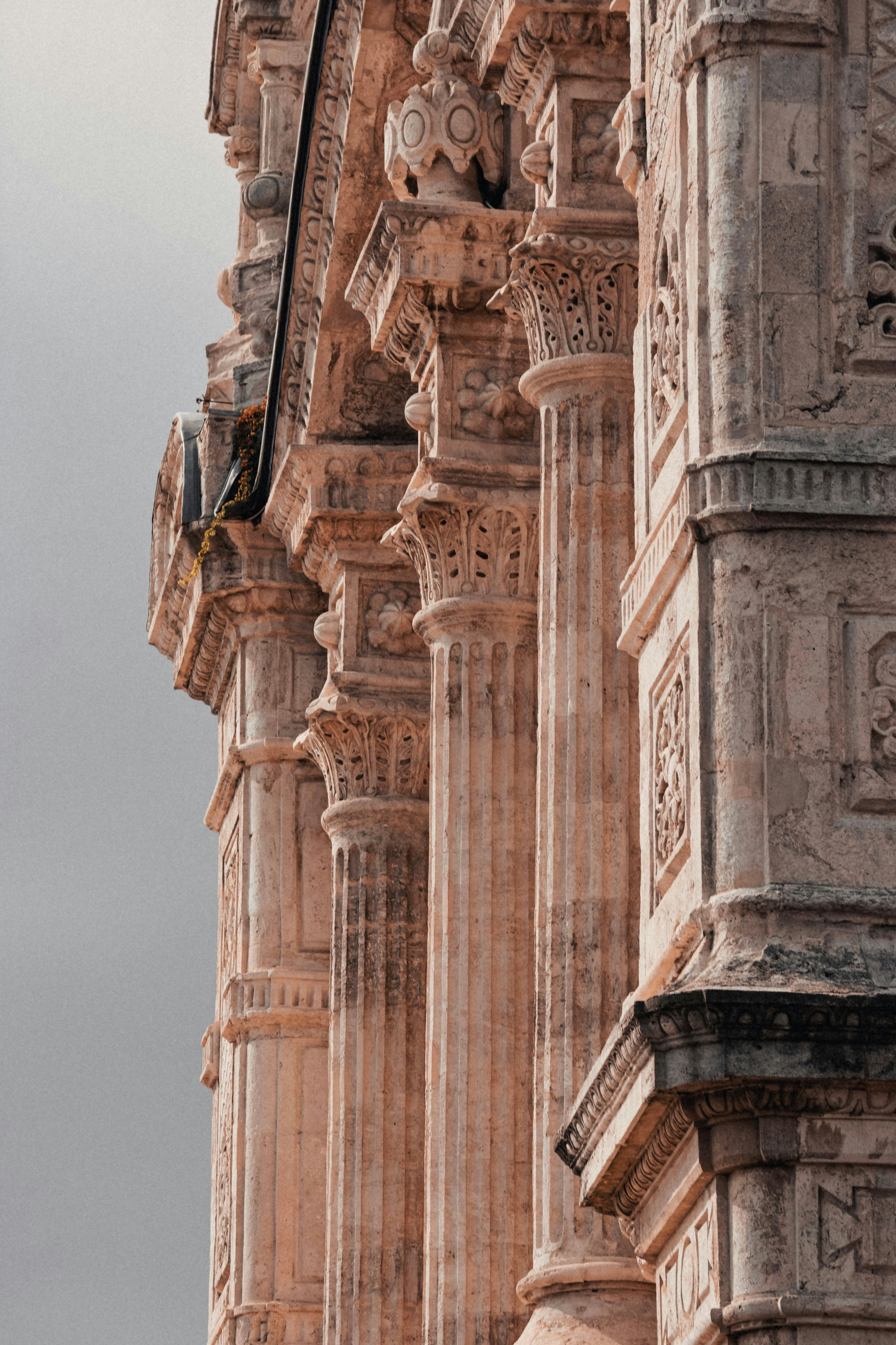 Weathered stone columns with intricate details on a historic building