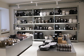 Store interior with shelves displaying black and white decorative items.