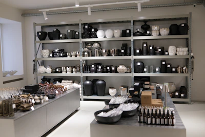 Store interior with shelves displaying black and white decorative items.