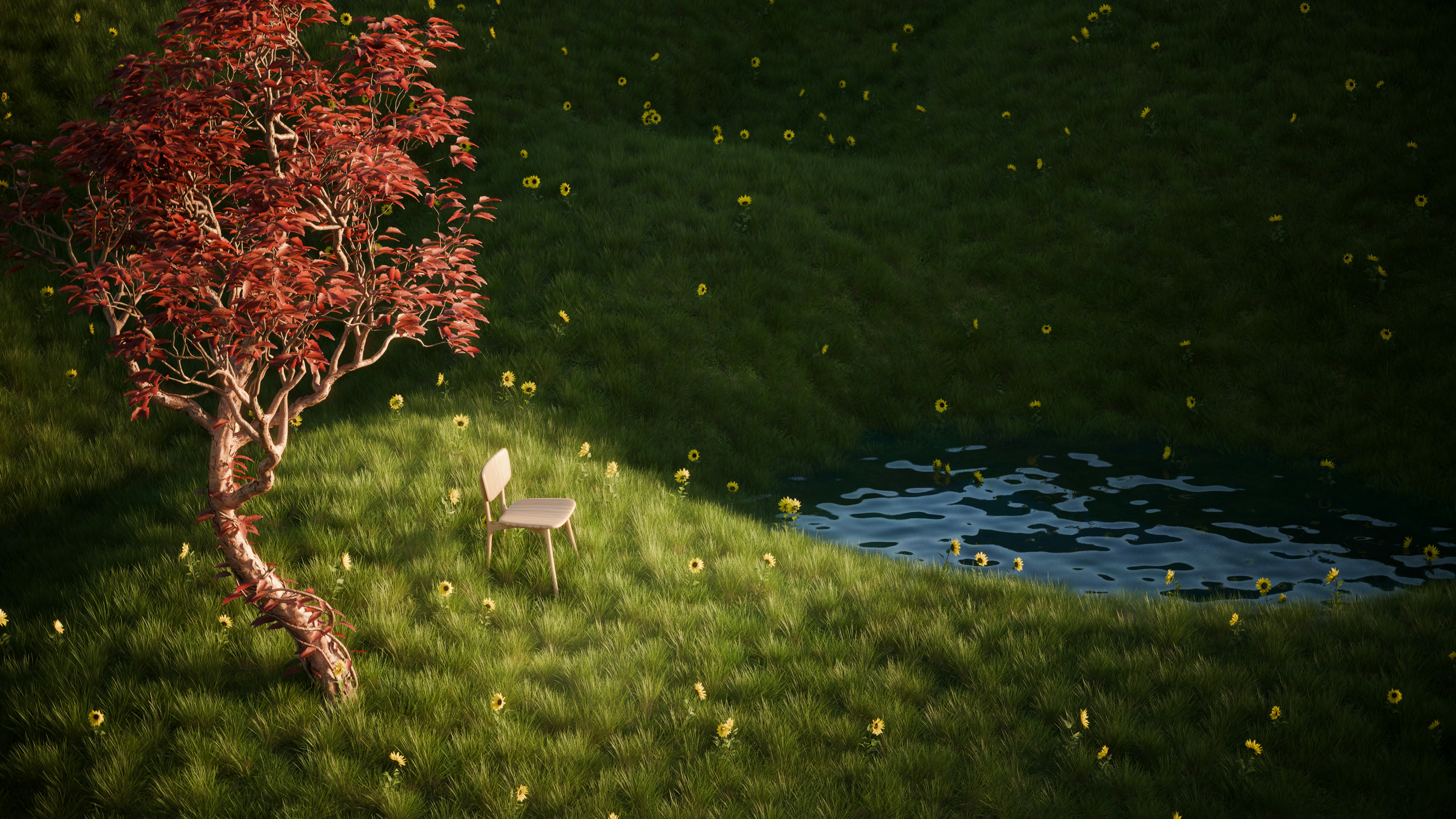 Red tree, chair, and pond on a green grassy hill.
