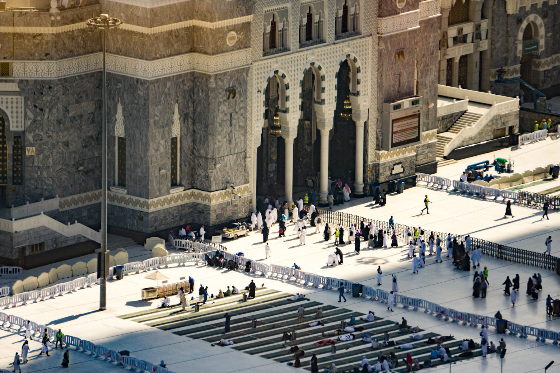Pilgrims entering the grand courtyard of Masjid al-Haram in Makkah at sunset