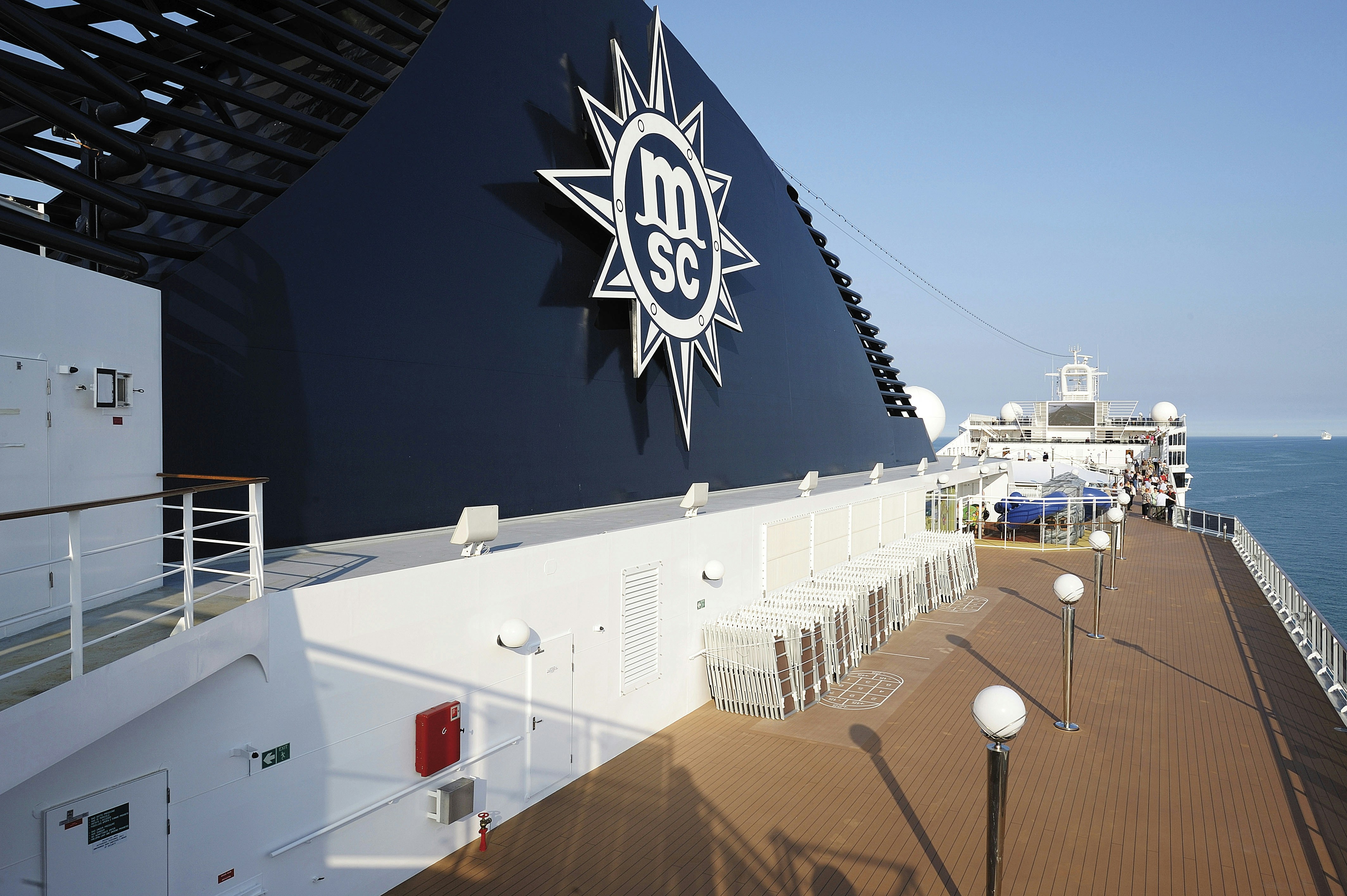 Large msc cruise ship funnel and deck with ocean view.