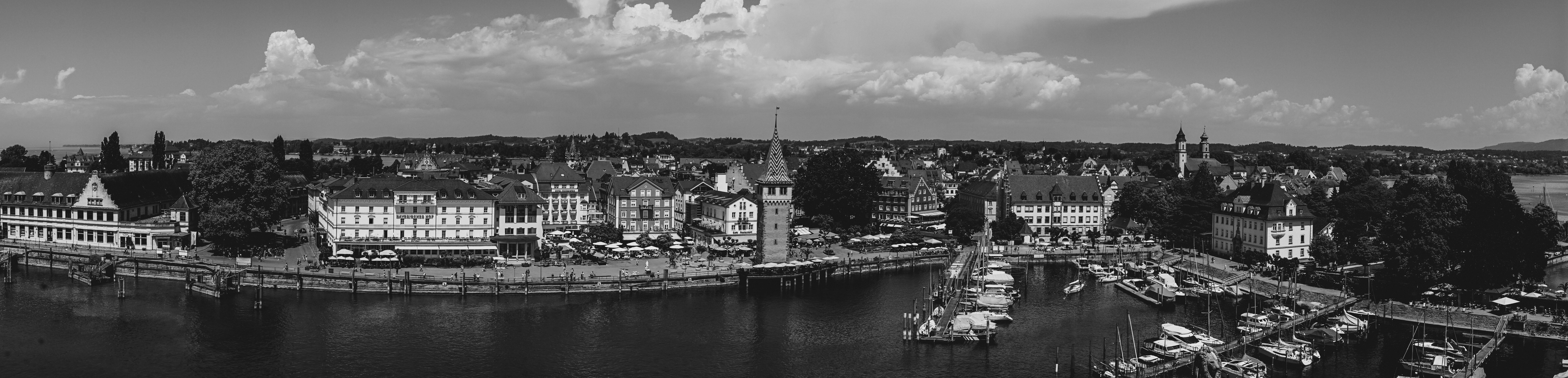 Panoramic view of a town with a harbor and boats.