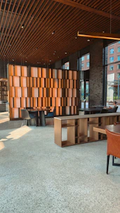 Stylish lounge area with wooden accents and natural light.