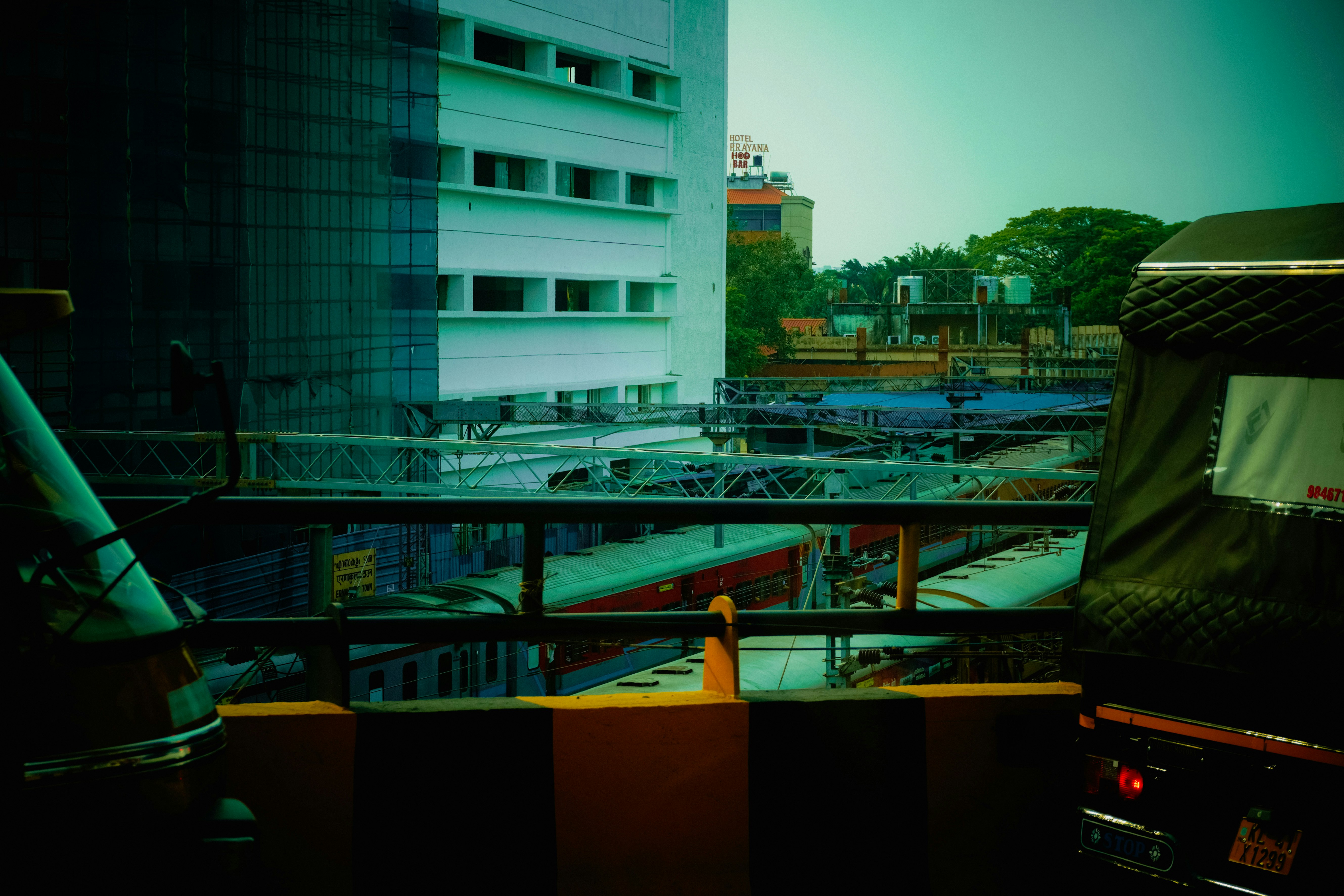An artistic rendering of a modern rare earth processing plant in Kerala, possibly near a coastal area, with sustainable design elements and clear skies, symbolizing technological advancement and environmental consciousness.