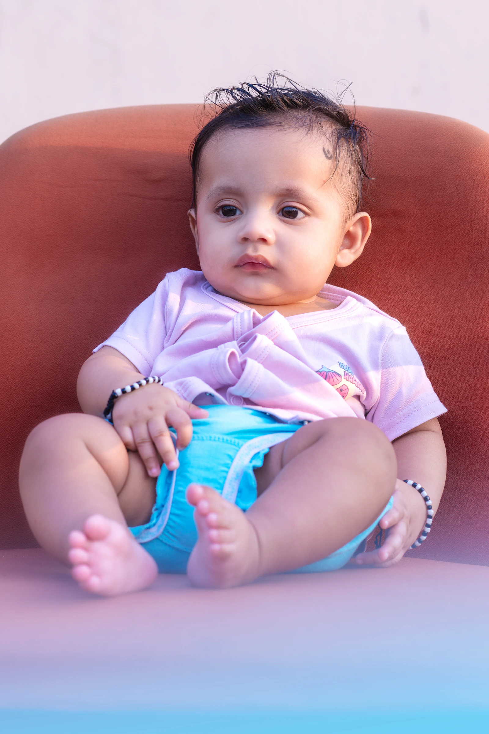 Infant resting comfortably in a soft outfit