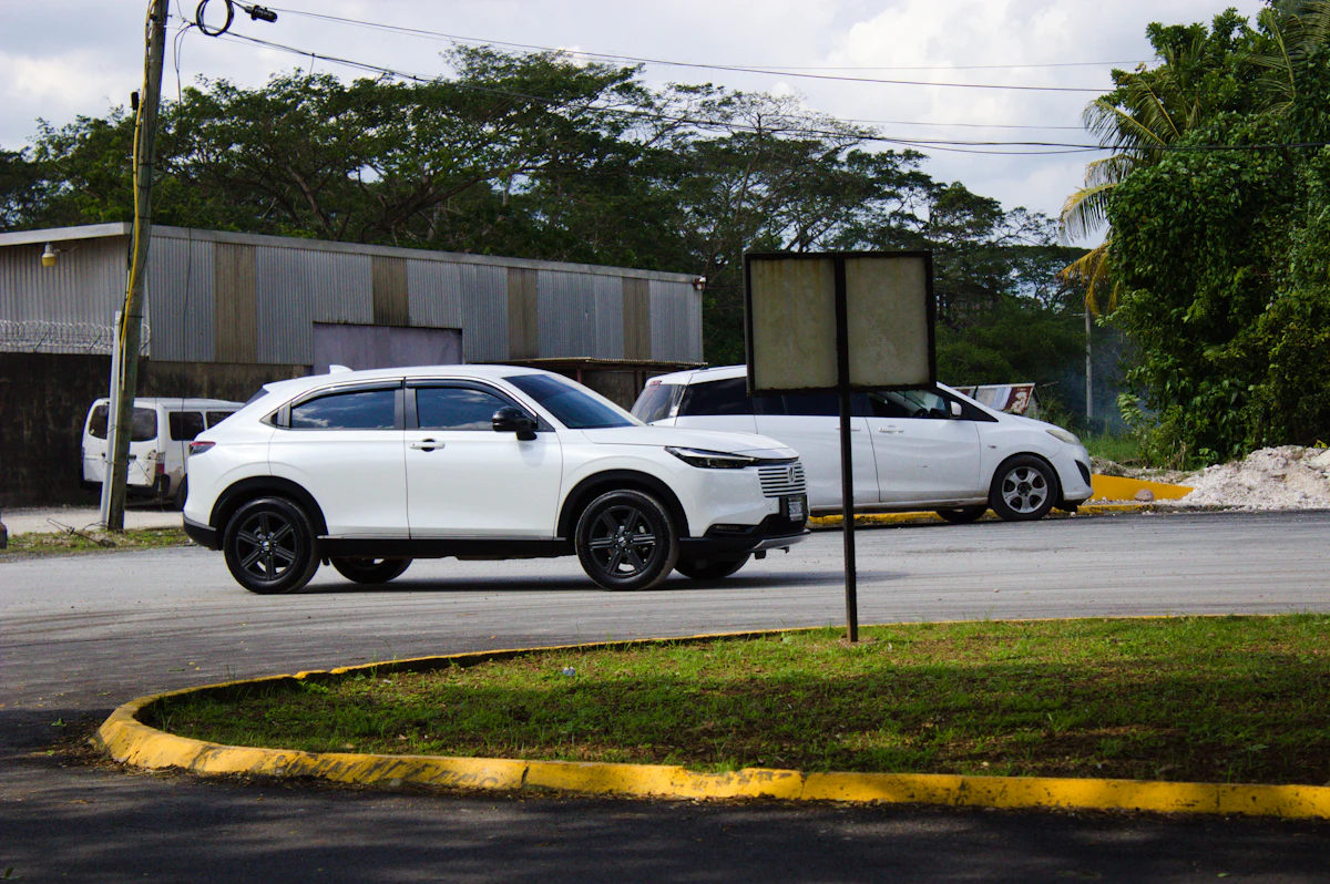 White Honda Vezel at a roundabout