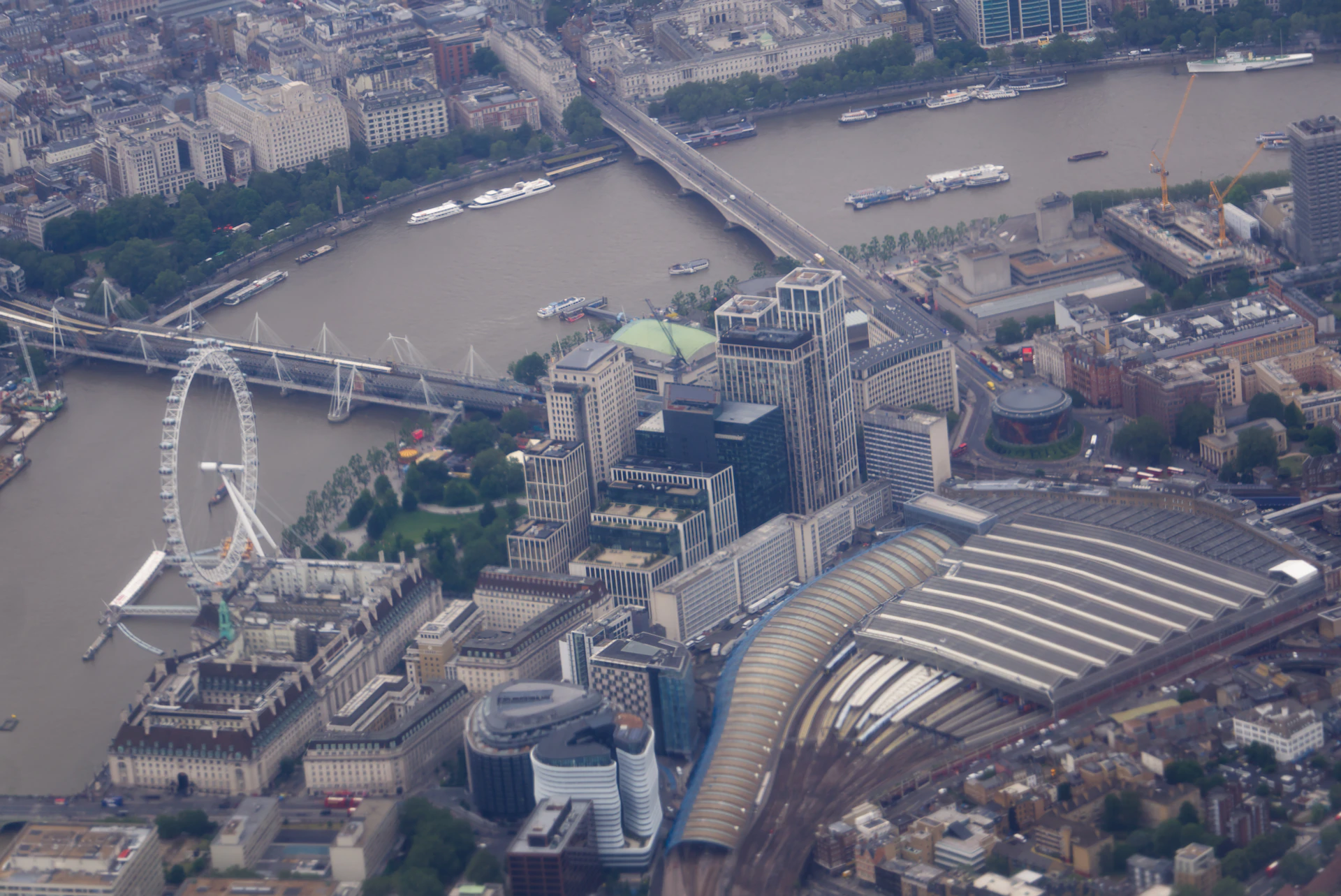 London cityscape from above, featuring thames, bridges, and london eye