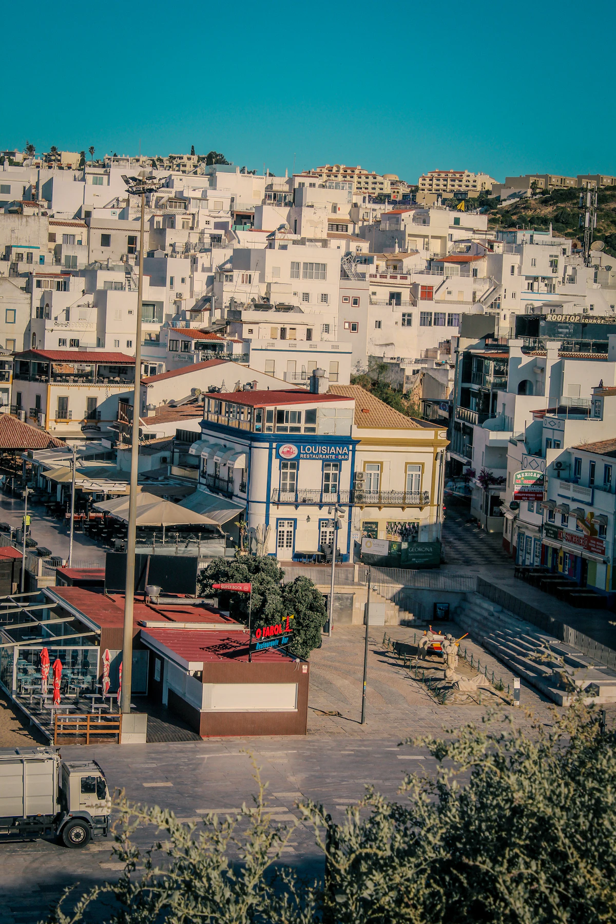 Sunny hillside with white architecture