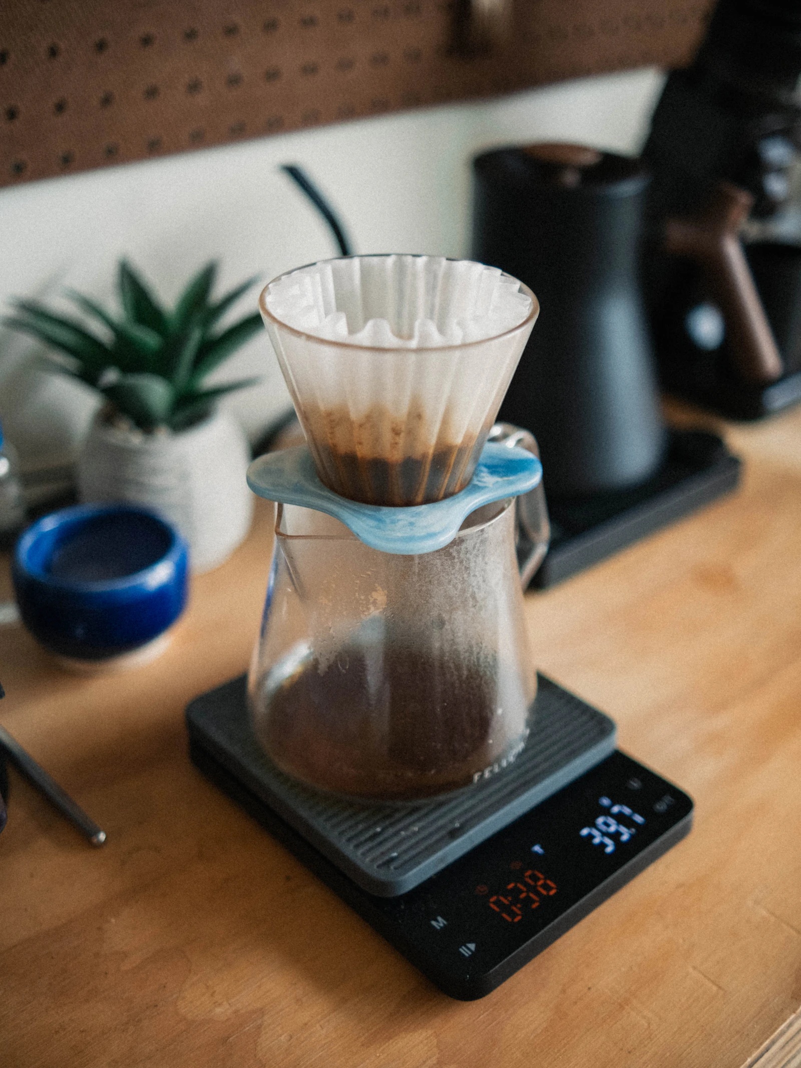 Pour-over specialty coffee being prepared in a café setting