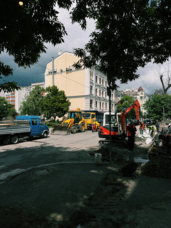 Roller compacting a work surface