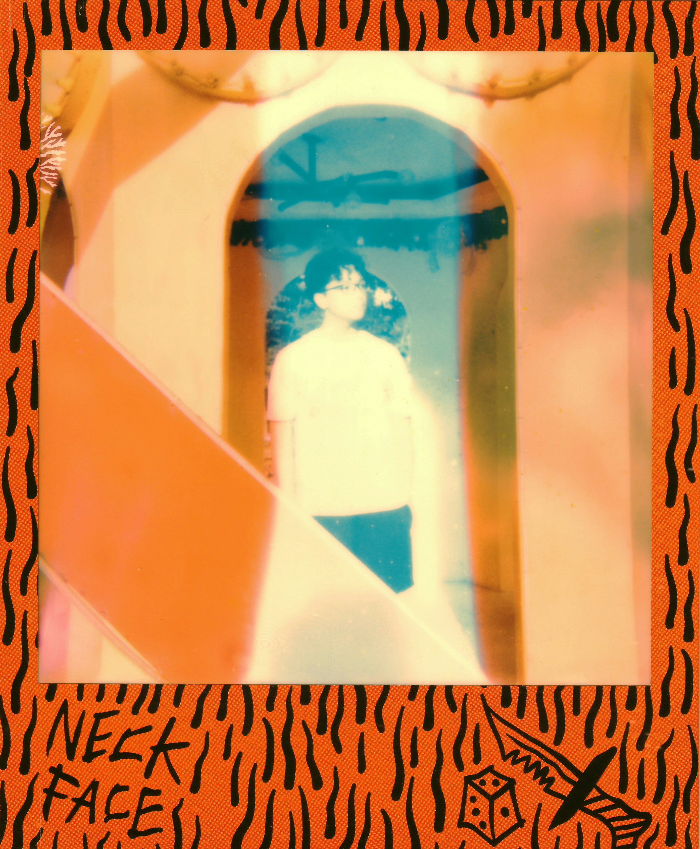 Person in a bright archway with an orange tiger-striped frame.