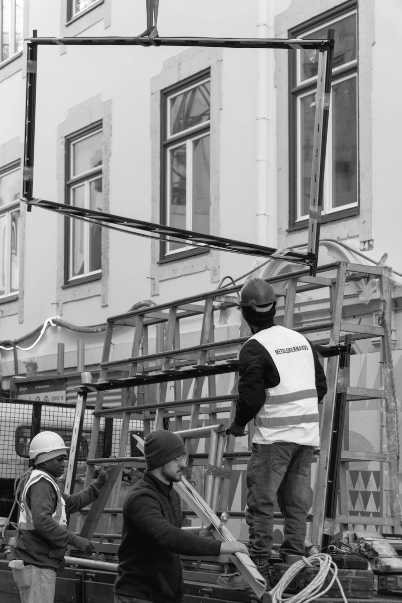 Technicians installing a facade window frame
