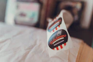 A roll of "gelatissimo" brand stickers on a white surface