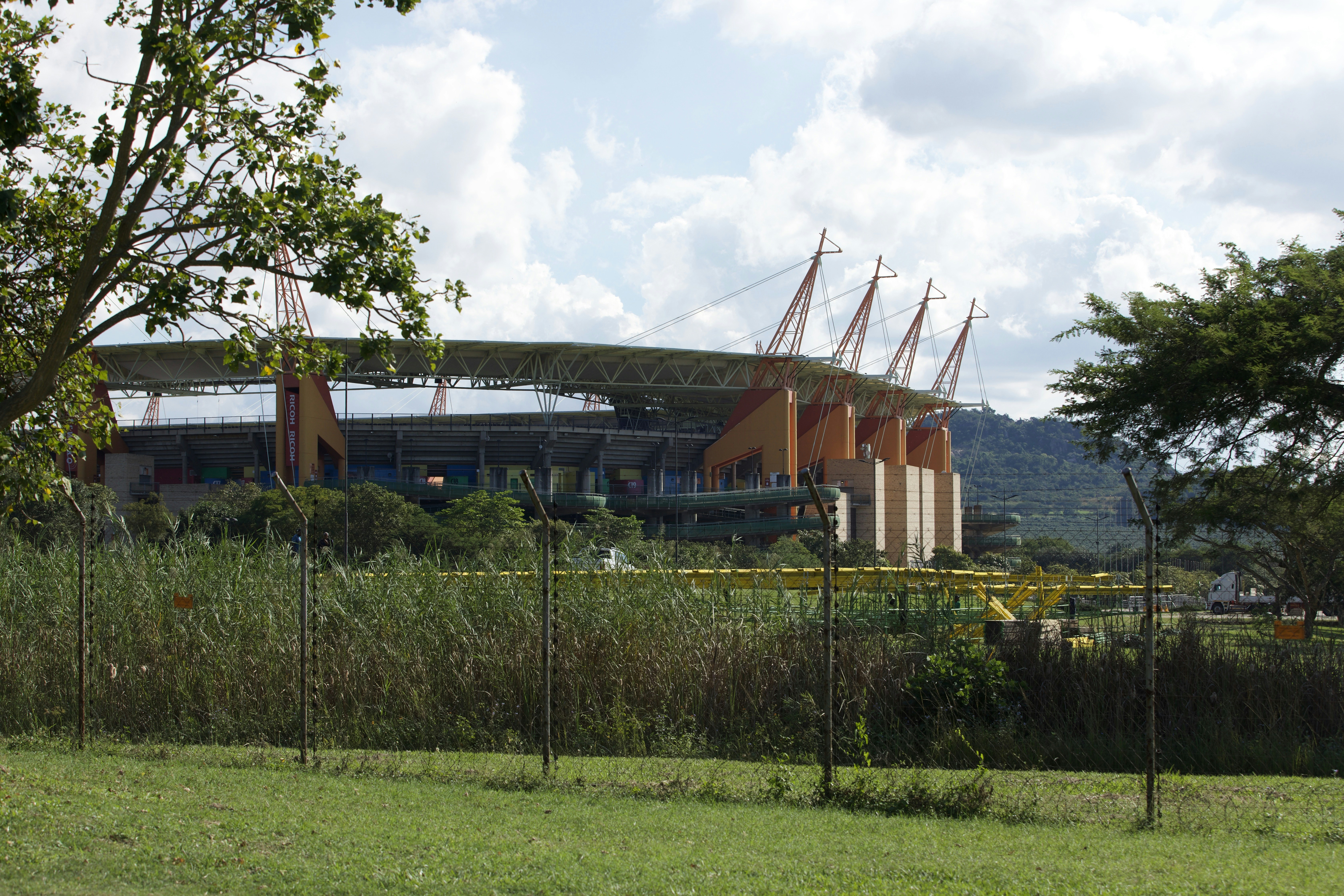 A large modern stadium surrounded by green trees and grass. — Bukayo Saka and the Impossible Lightness of Being England's Plan A
