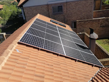 Solar panels installed on a tiled residential roof.