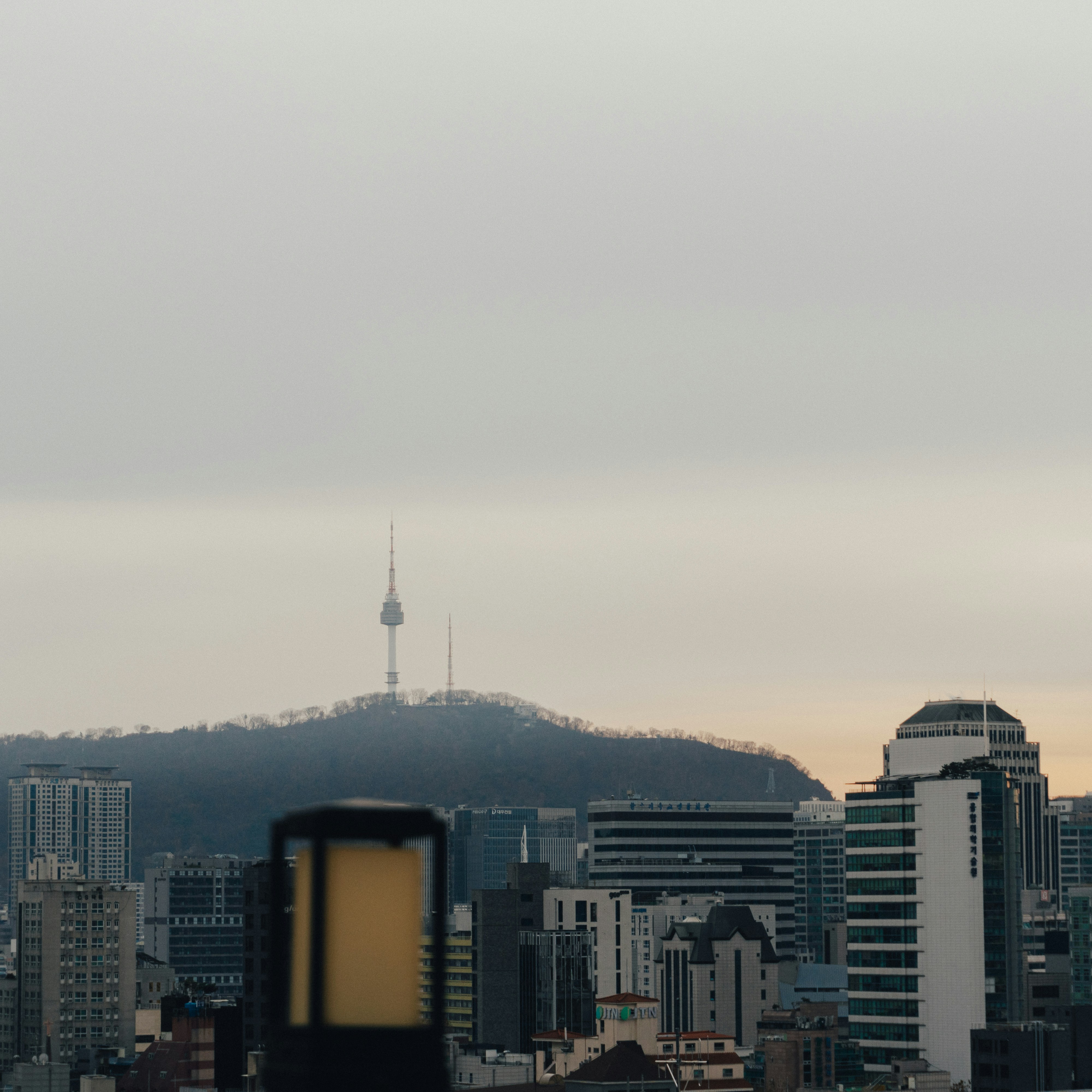 Black and white skyline of Seoul with N Seoul Tower, the Han River and city high-rises
