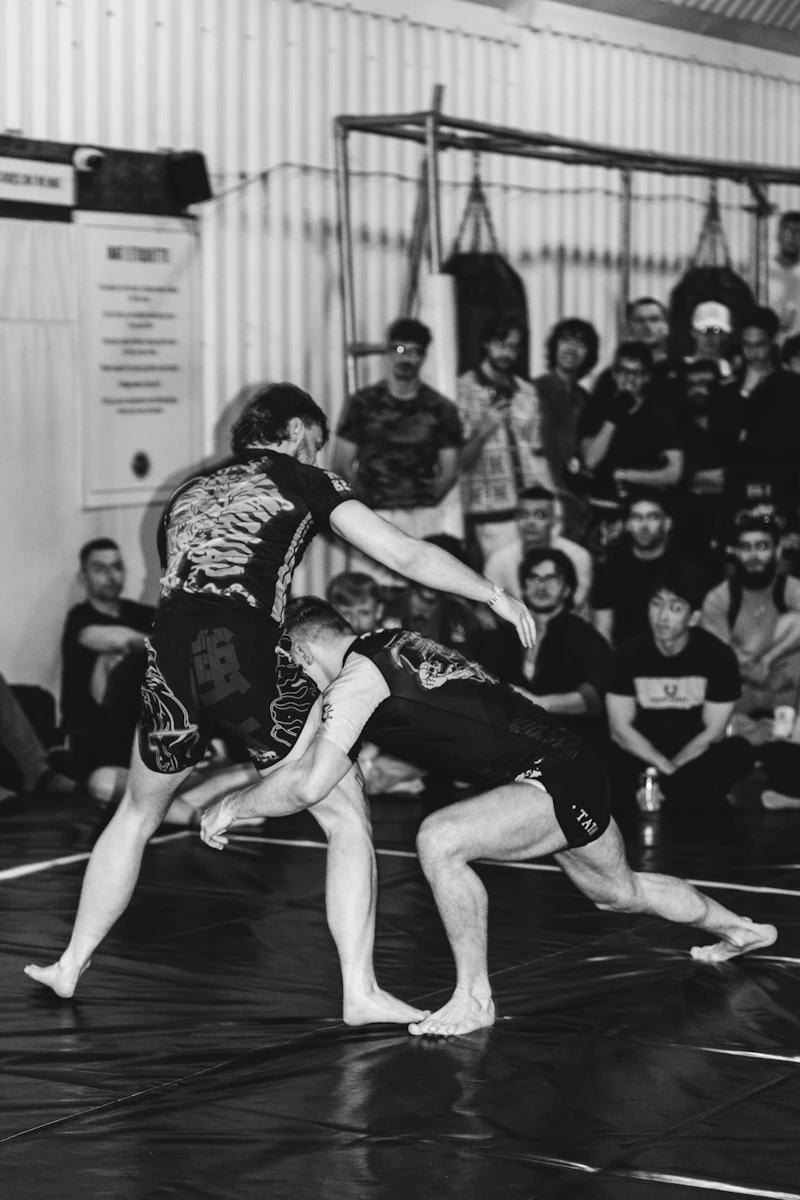 BJJ students drilling technique on the mat