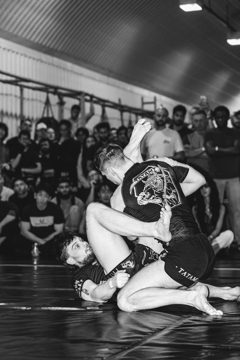 BJJ competitor grappling during a tournament match