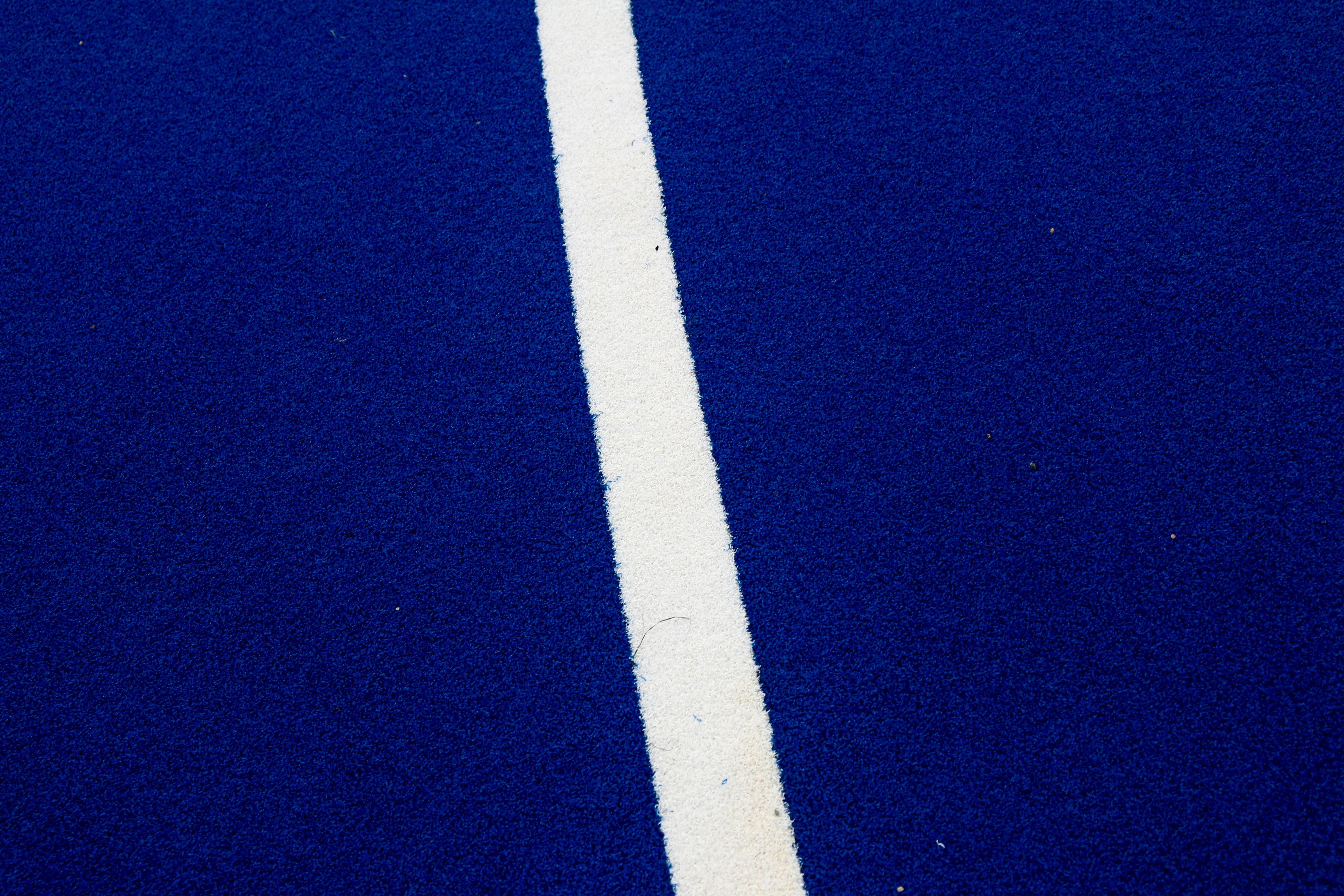 A blue background with a white diagonal line.