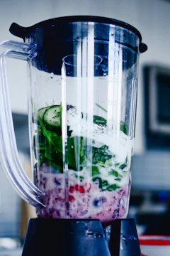 Vitamix 5200 blender with fresh smoothie ingredientsuid inside a blender.