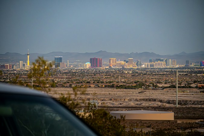 The Las Vegas valley skyline seen from the desert with the Spring Mountains behind it, as the city prepares to mark nine years since 1 October