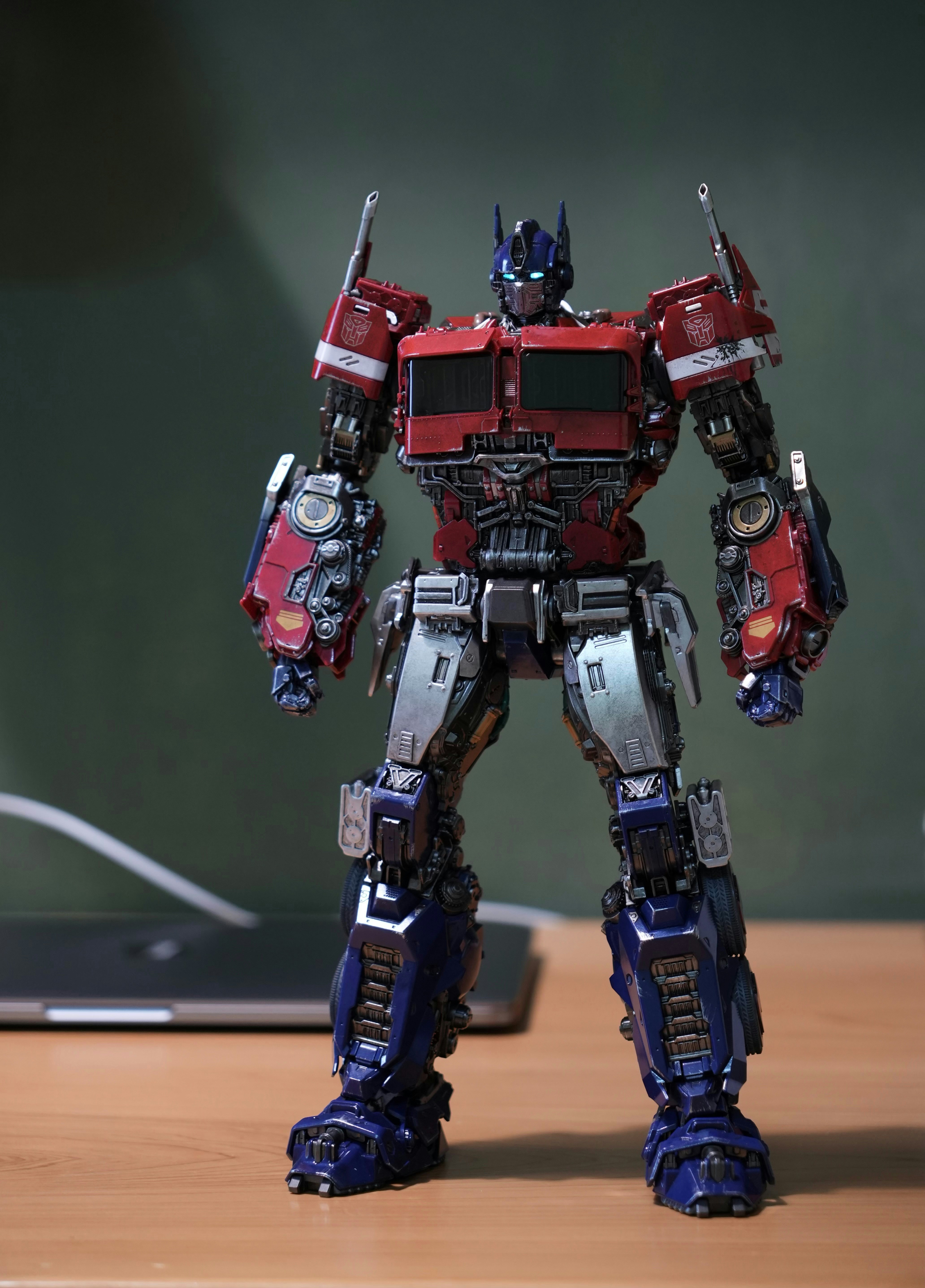 Optimus prime action figure standing on a table.
