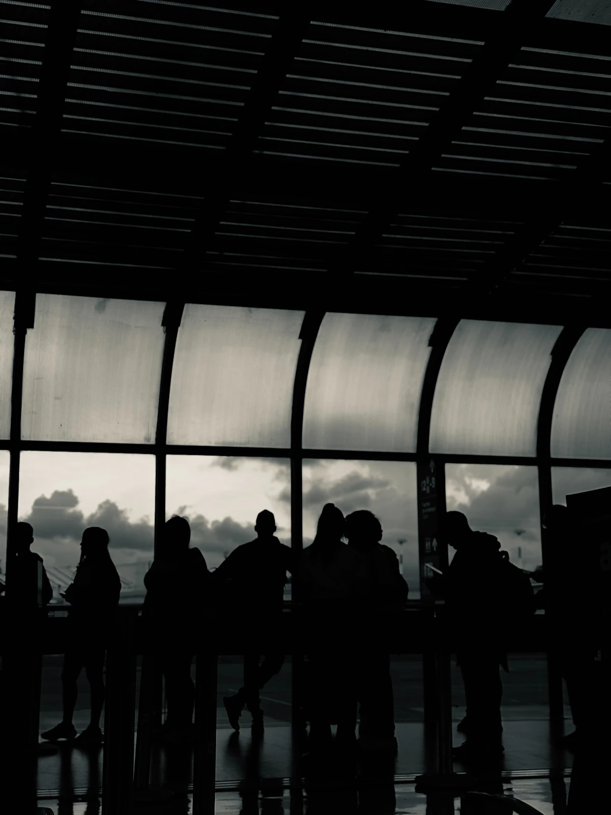 Passengers waiting at an airport gate