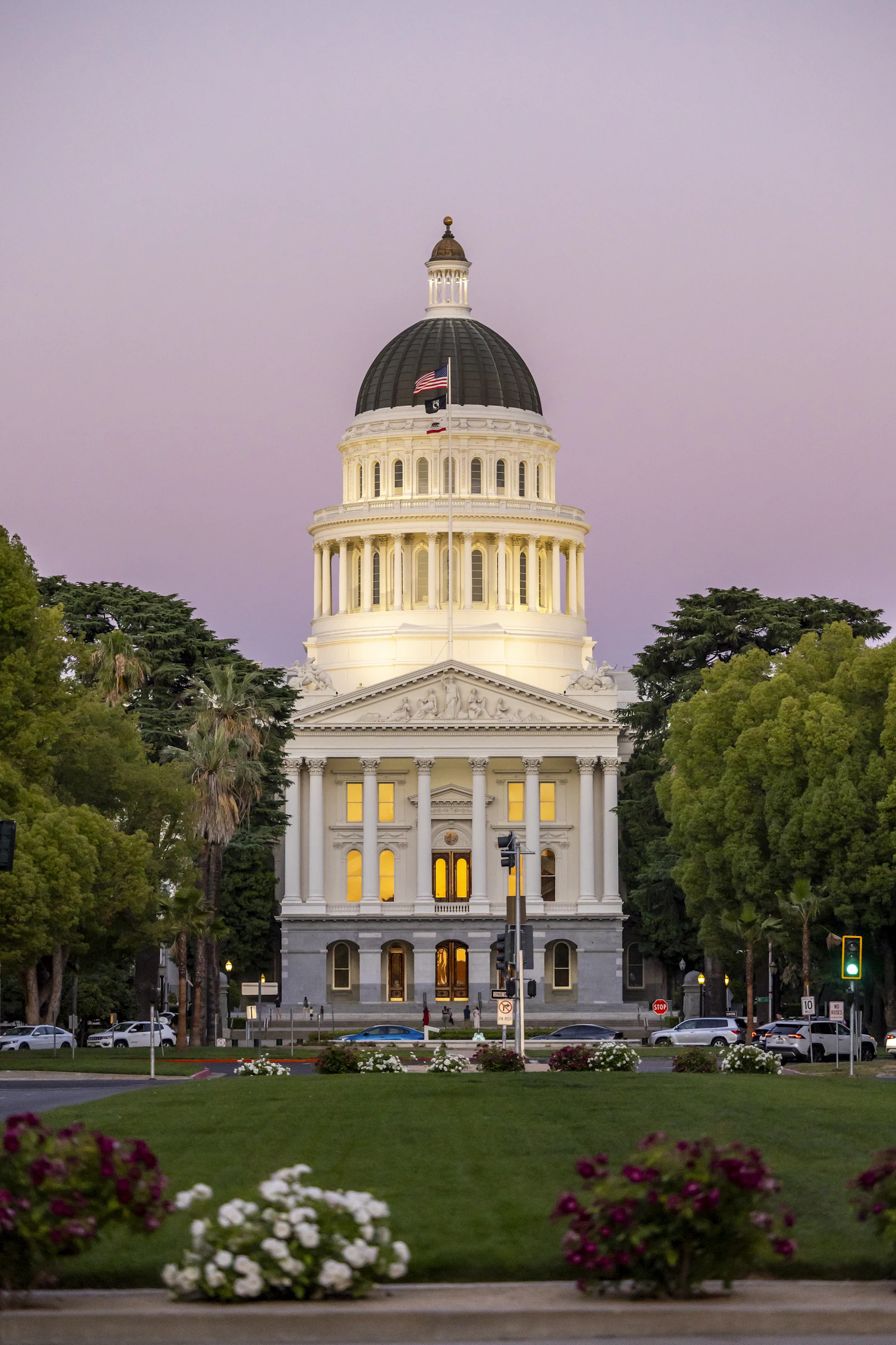 Illuminated state capitol building at dusk
