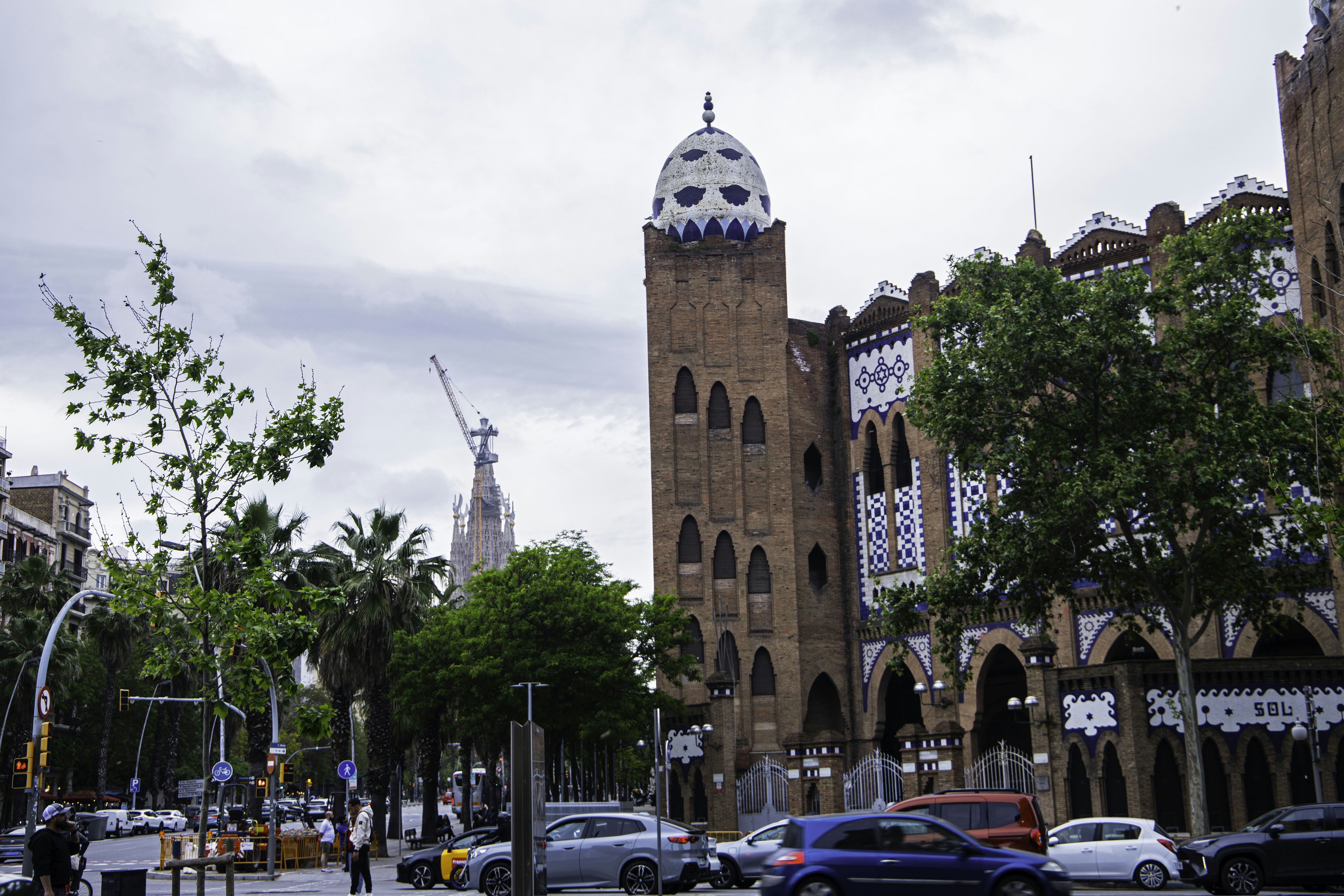 Distinctive building with a white dome on a city street.