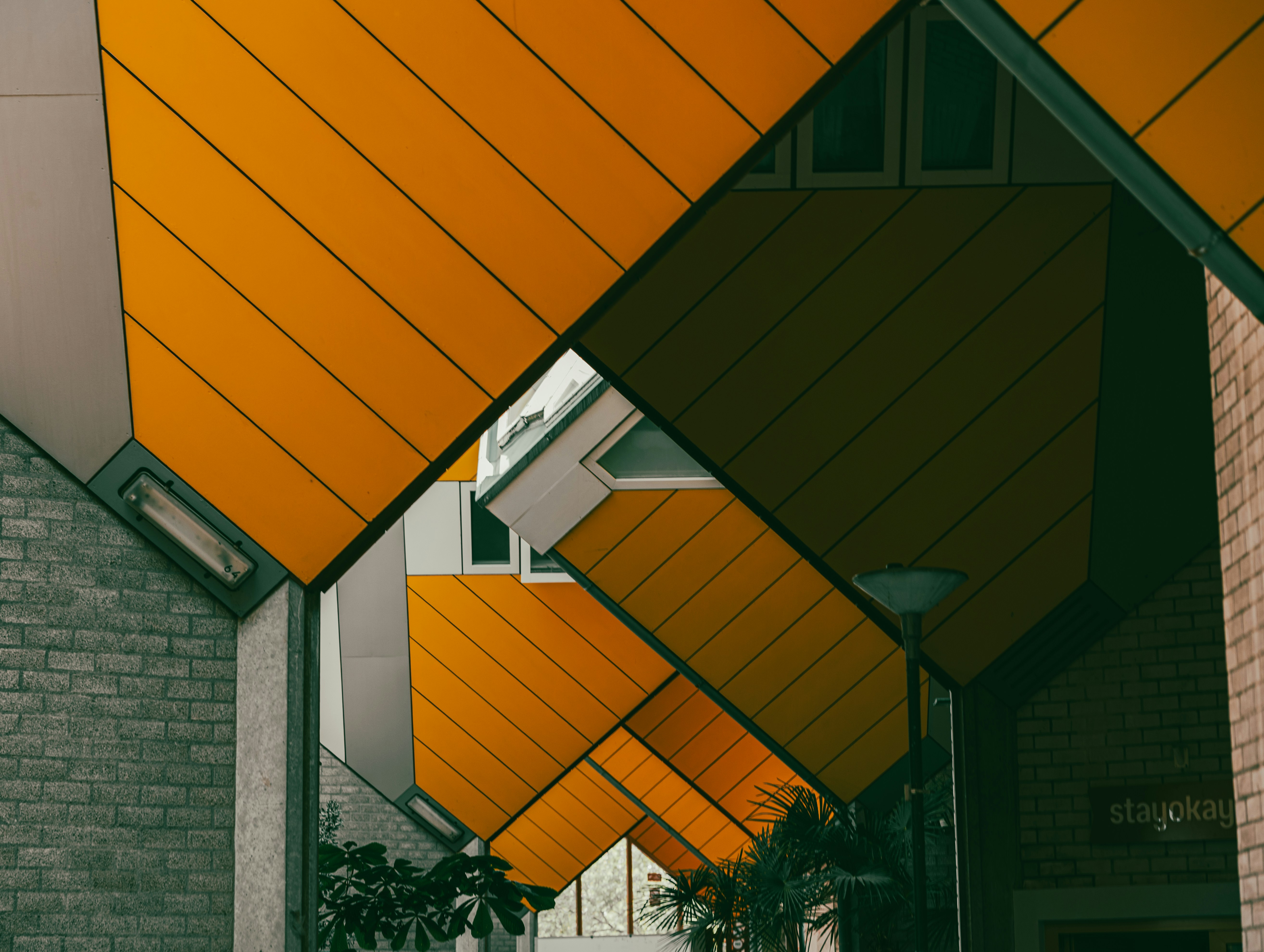 Unique yellow cube houses with geometric architecture.