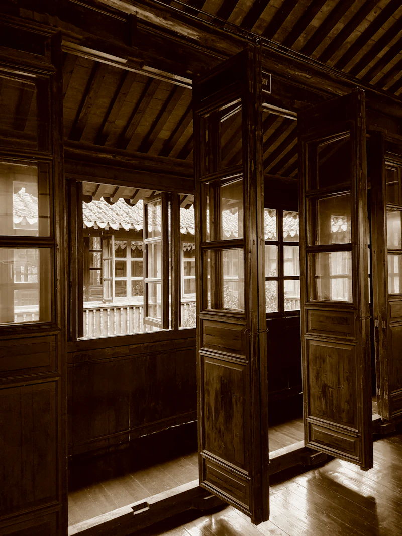 Open wooden doors of the old building