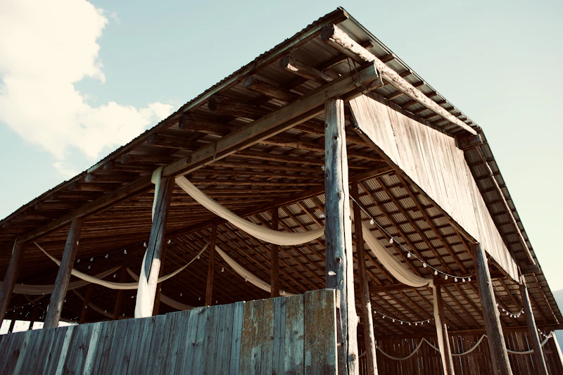 Rustic barn interior decorated for a fall wedding