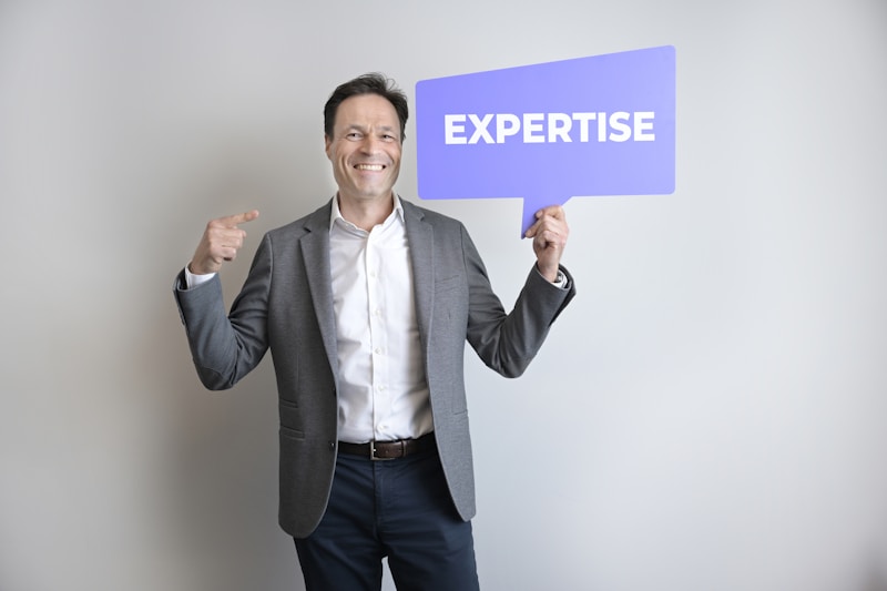 Expert holding expertise recognition sign