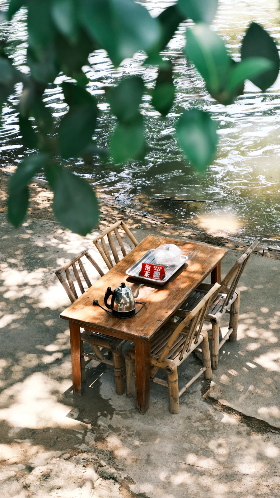 Rustic table beside a shimmering river