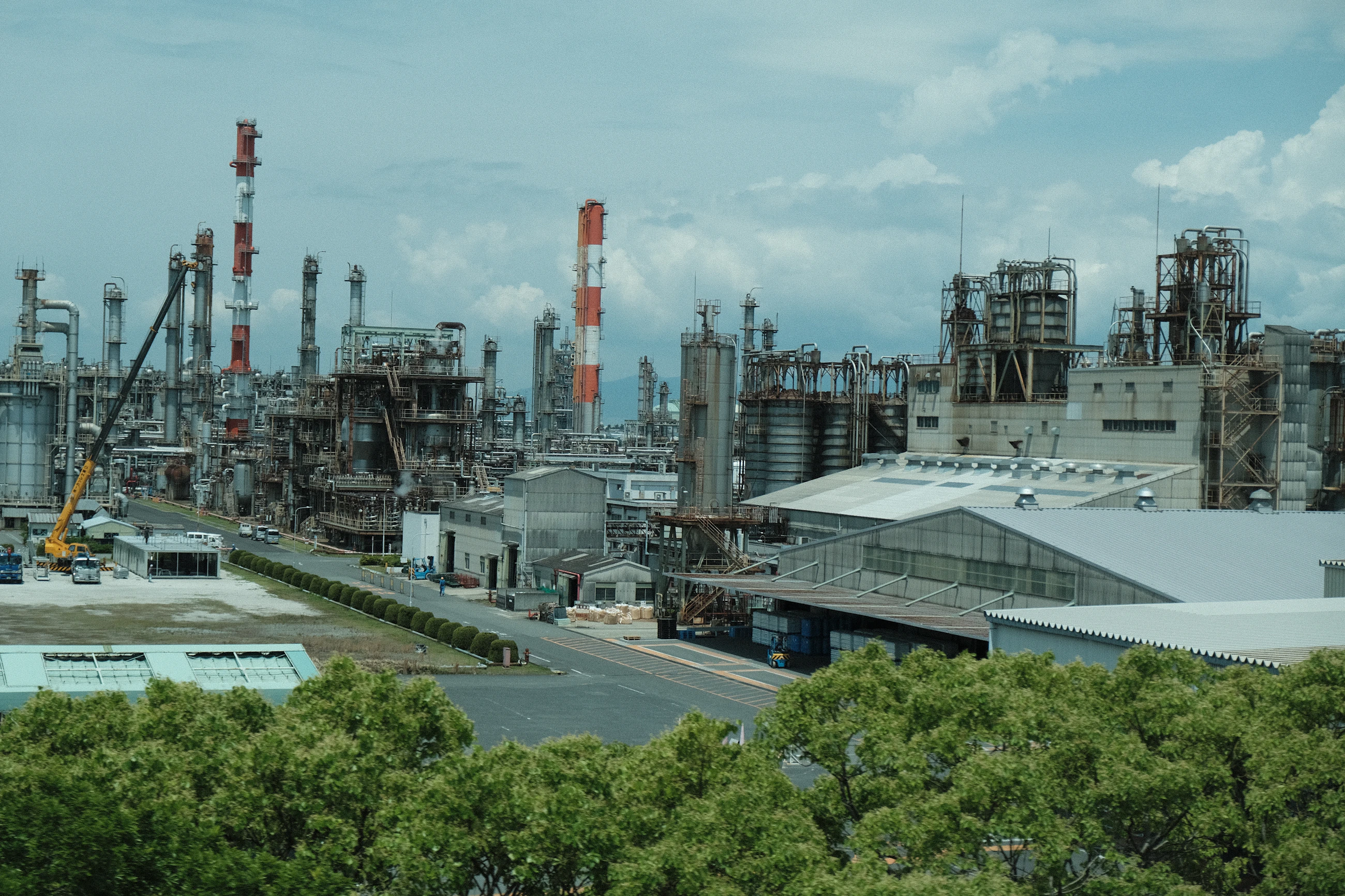 Industrial processing complex with tanks and pipework