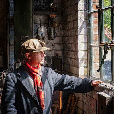 Charcoal wool flat cap — photo by Phil Robson on Unsplash