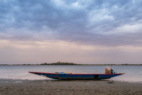 A pirogue drawn up on the shore — Sine-Saloum Delta, Senegal
