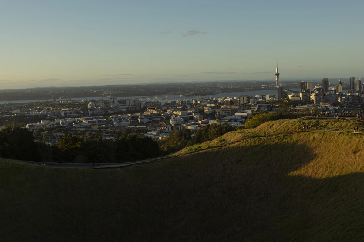 Auckland skyline and harbour seen from Maungawhau Mount Eden at sunset