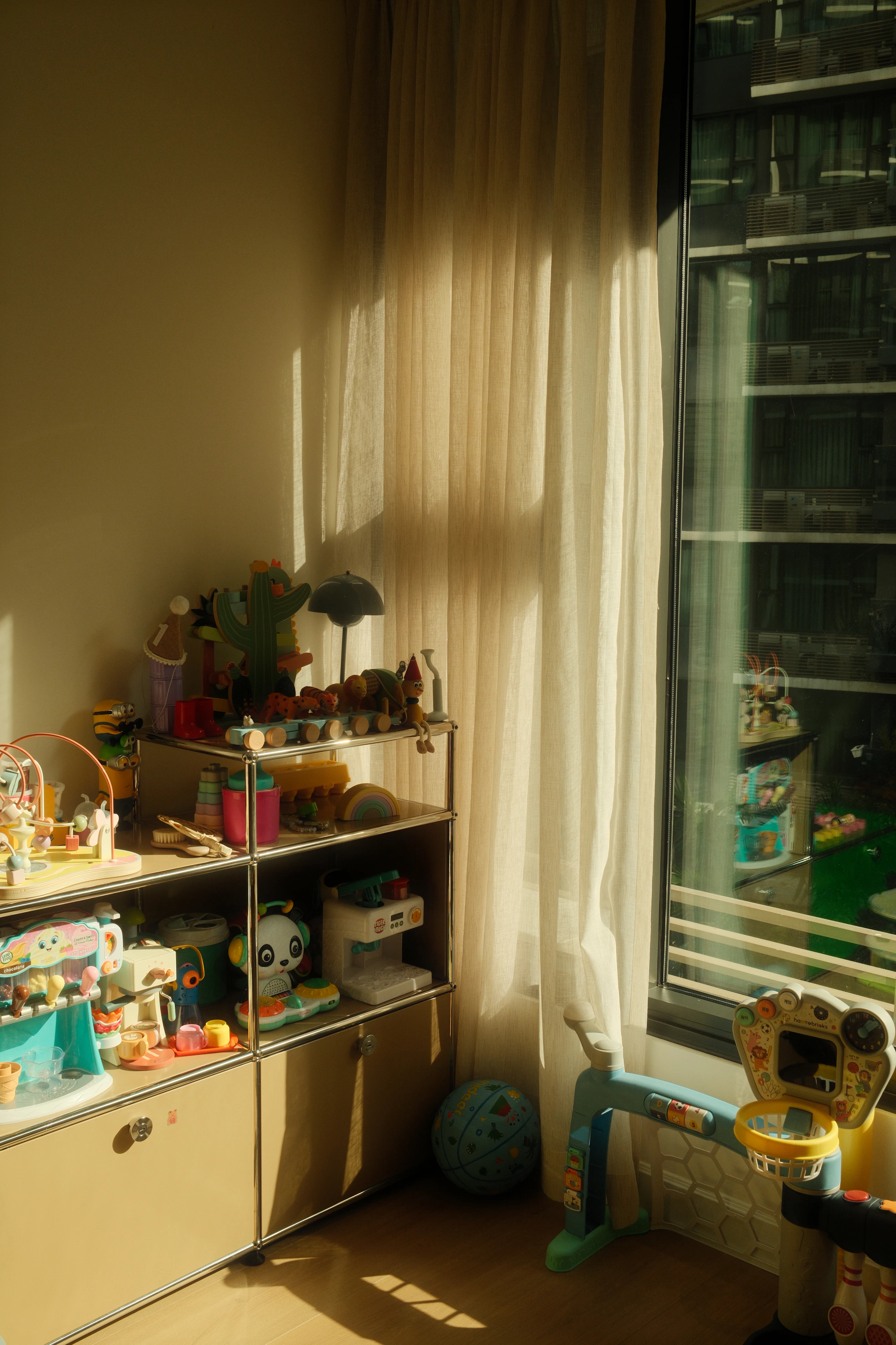 A sunlit children's playroom filled with toys