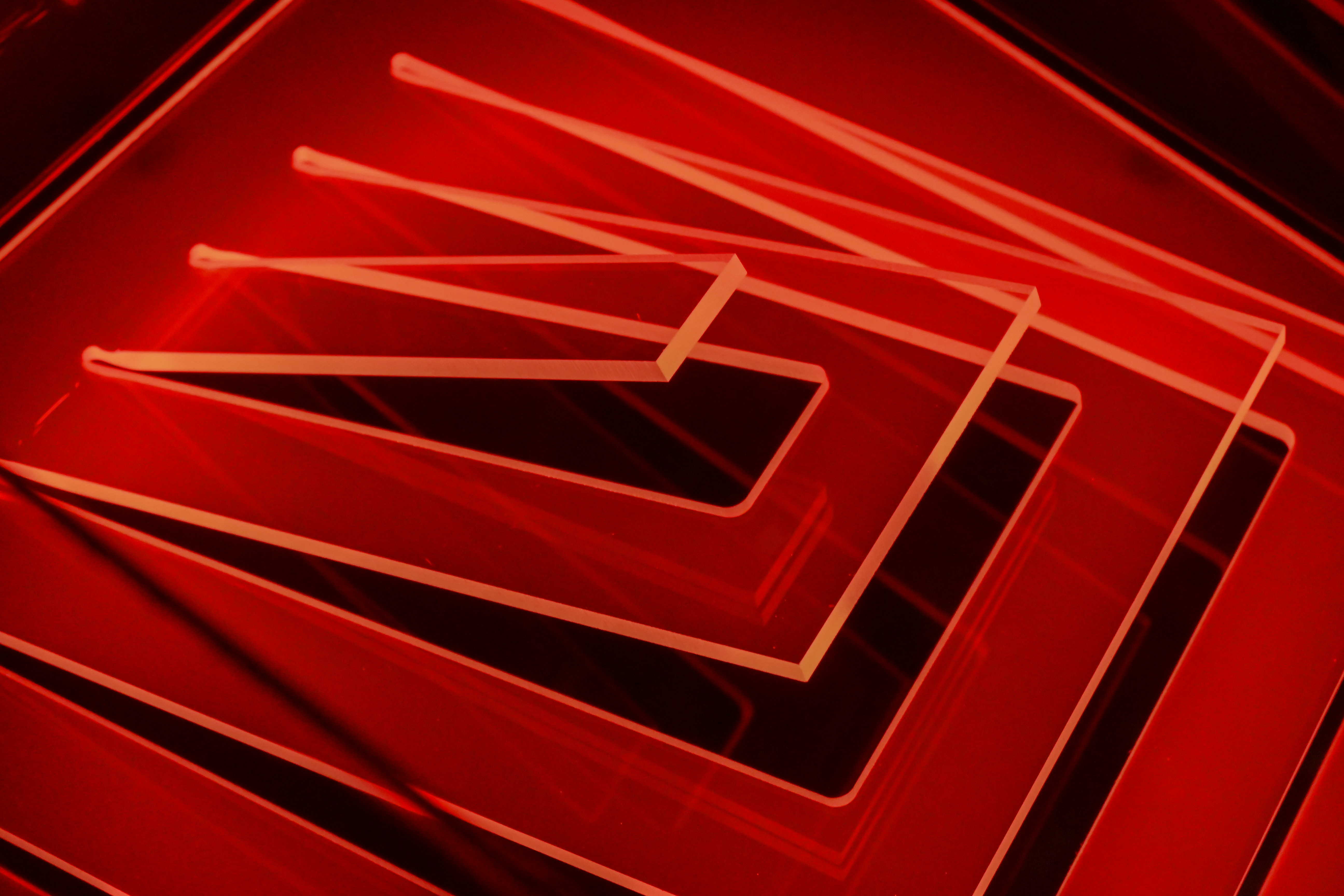 Vibrant red abstract geometric lines and shapes.