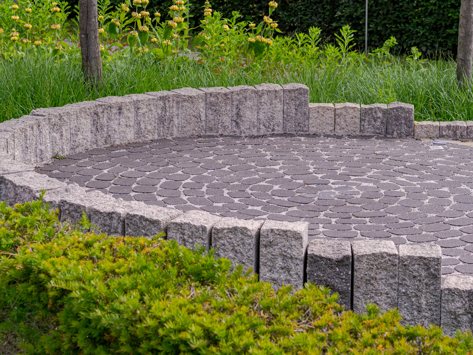 Stone terrace with seat wall