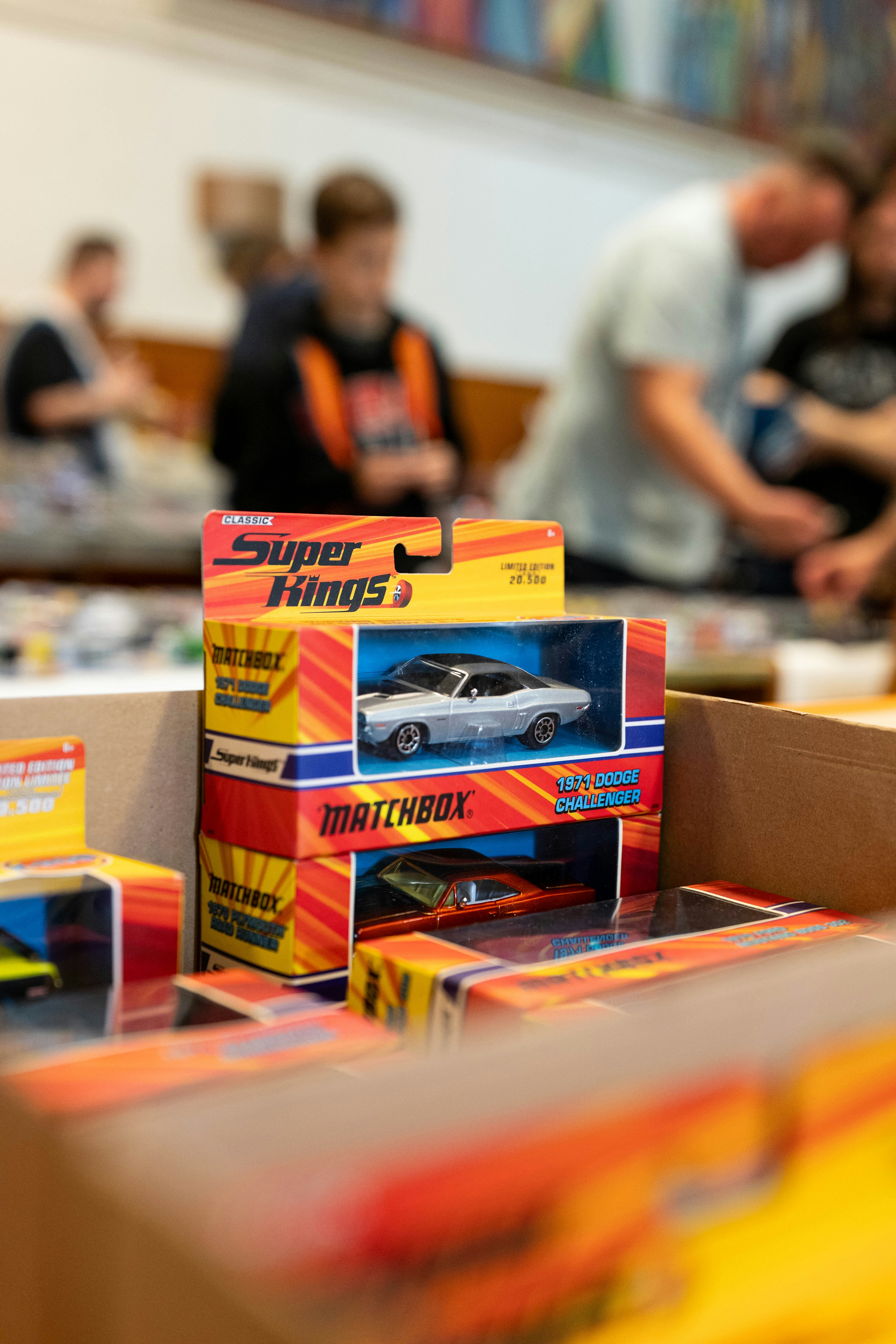 Matchbox super kings toy cars stacked in their packaging.