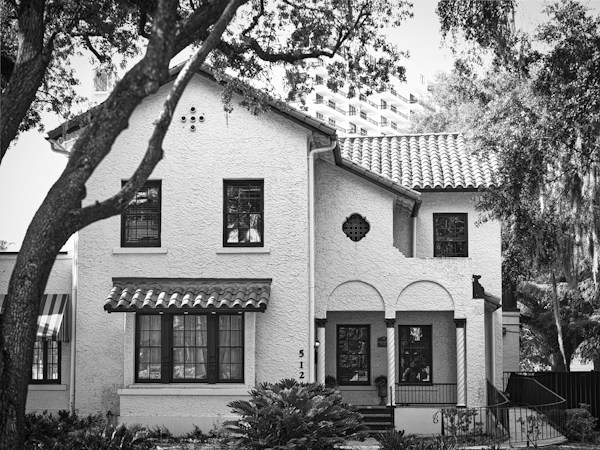 Two-story house with a tiled roof, similar to the single-family homes buyers purchase as income rentals in Las Vegas