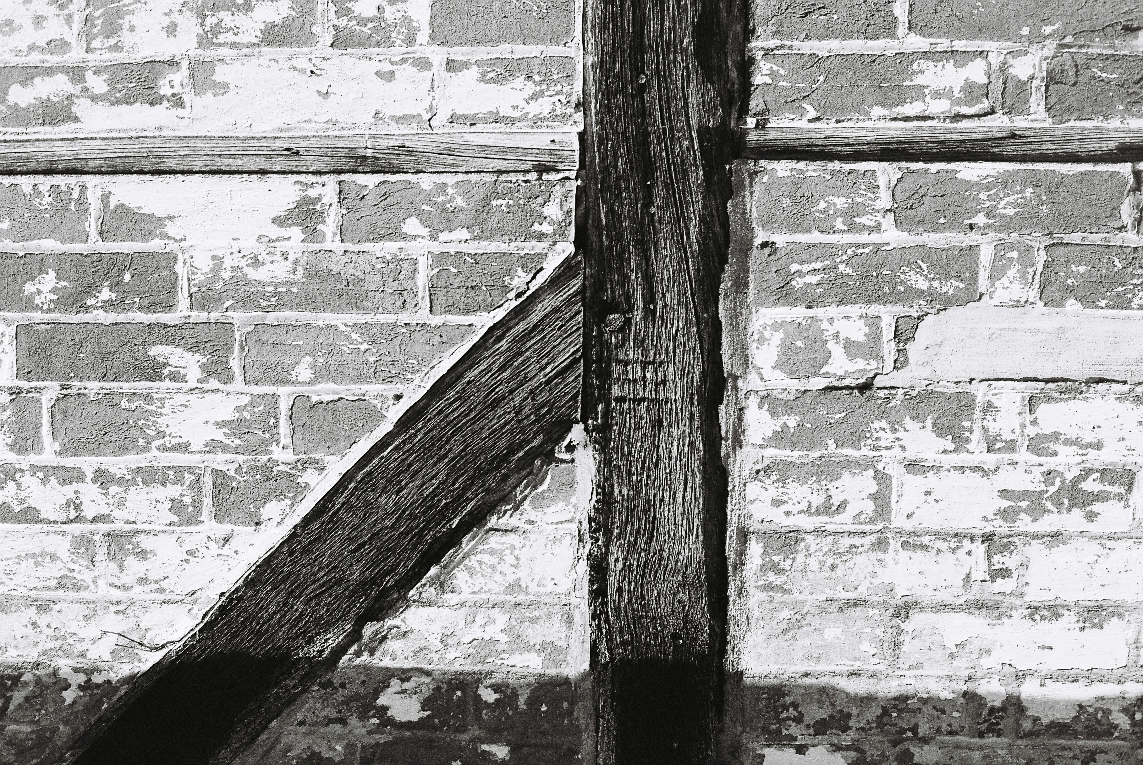 exposed brick walls and timber beams in a historic loft